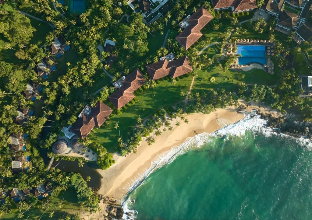 Aerial view of Anantara Peace Haven rocky headland and private beach in Tangalle