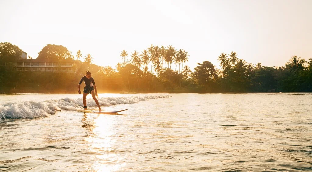 Relaxed surf lessons along the sandy shallows of Arugam Bay