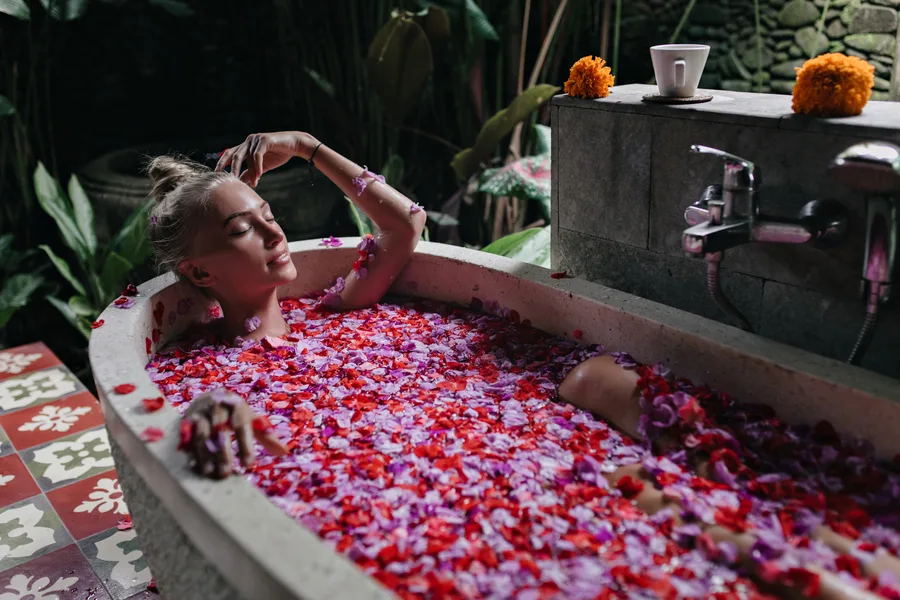 Relaxing floral and herbal bath infused with fresh rose petals and medicinal botanicals
