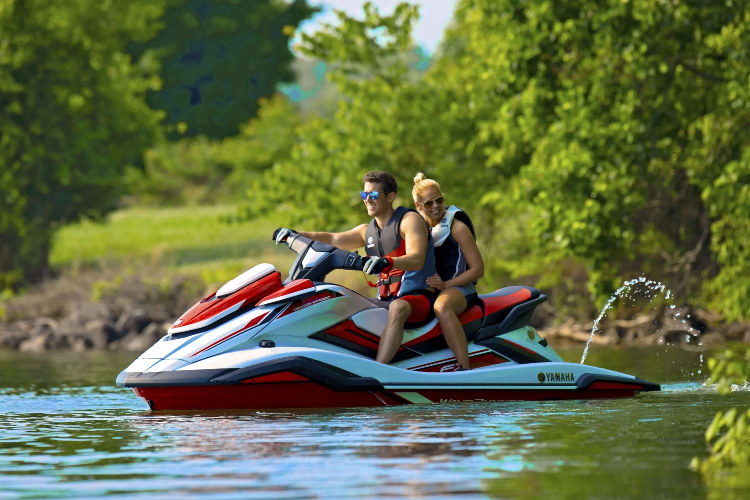 Couples enjoying high-speed jet skiing across the Bentara River lagoon in Bentota