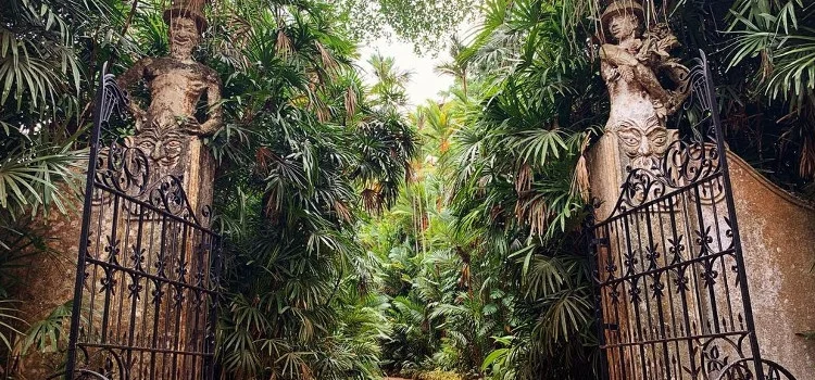 Verdant garden walkways and eclectic sculptures throughout the Brief estate