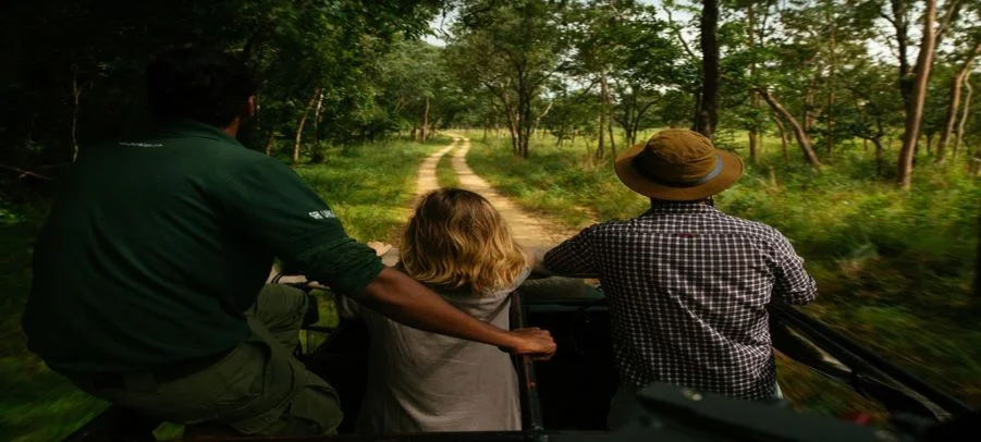 Couples open-top wildlife safari jeep tour