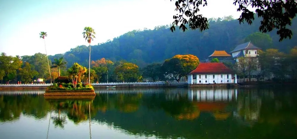 Panoramic view of Kandy Lake with the surrounding wooded hills and city center