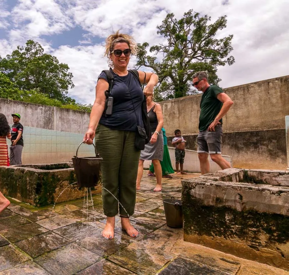 Visitors drawing water from the wells at Kanniya Hot Springs