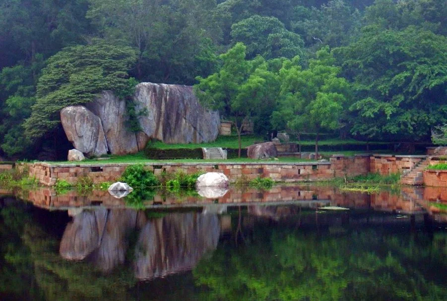 Ancient monastic pond of Kaludiya Pokuna nestled in the forested slopes of Mihintale