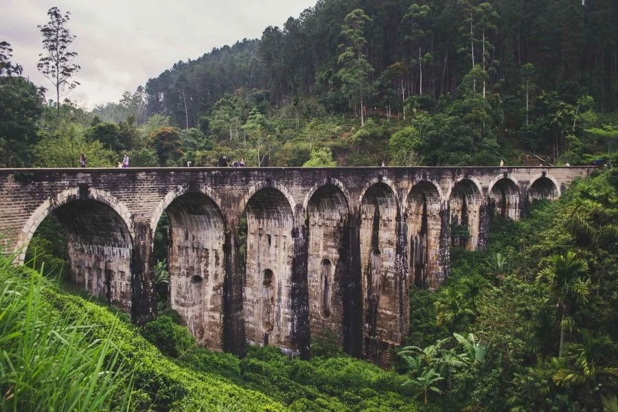 The historic Nine Arches Bridge viaduct curving through forested tea valleys near Demodara in Ella