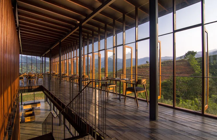 Open-air dining deck with sweeping mountain vistas at Santani Wellness Resort