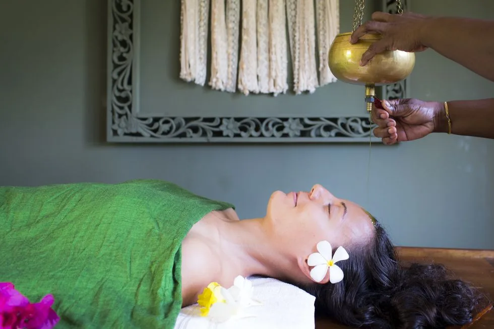 Traditional Shirodhara warm oil pouring therapy