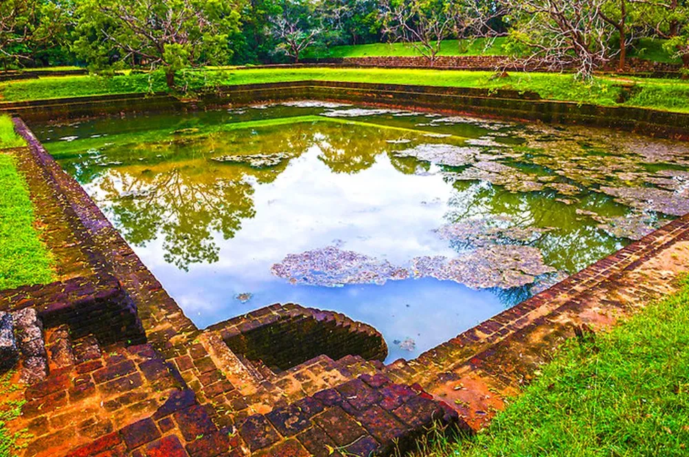 Sigiriya Rock Fortress rising dramatically above surrounding plains