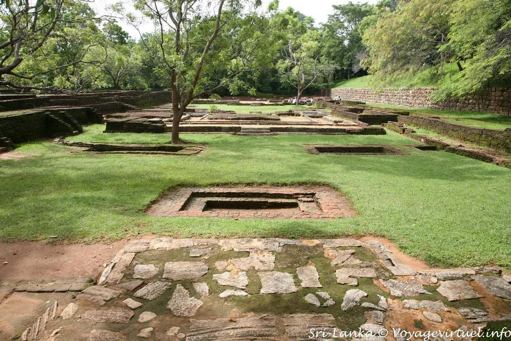 Concentric brick terrace gardens ascending toward Sigiriya rock