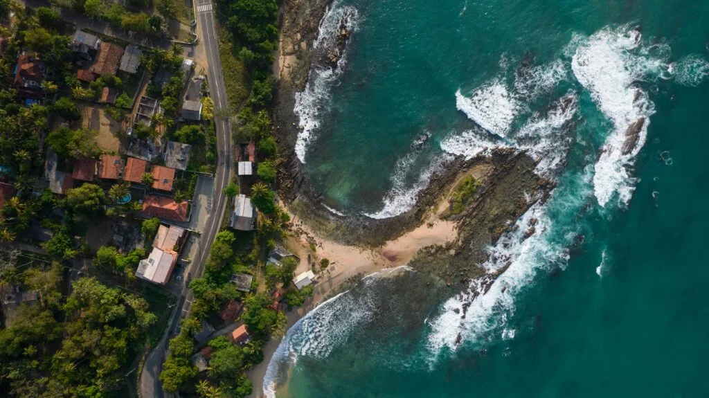 Unspoiled turquoise waters and palm groves in Tangalle