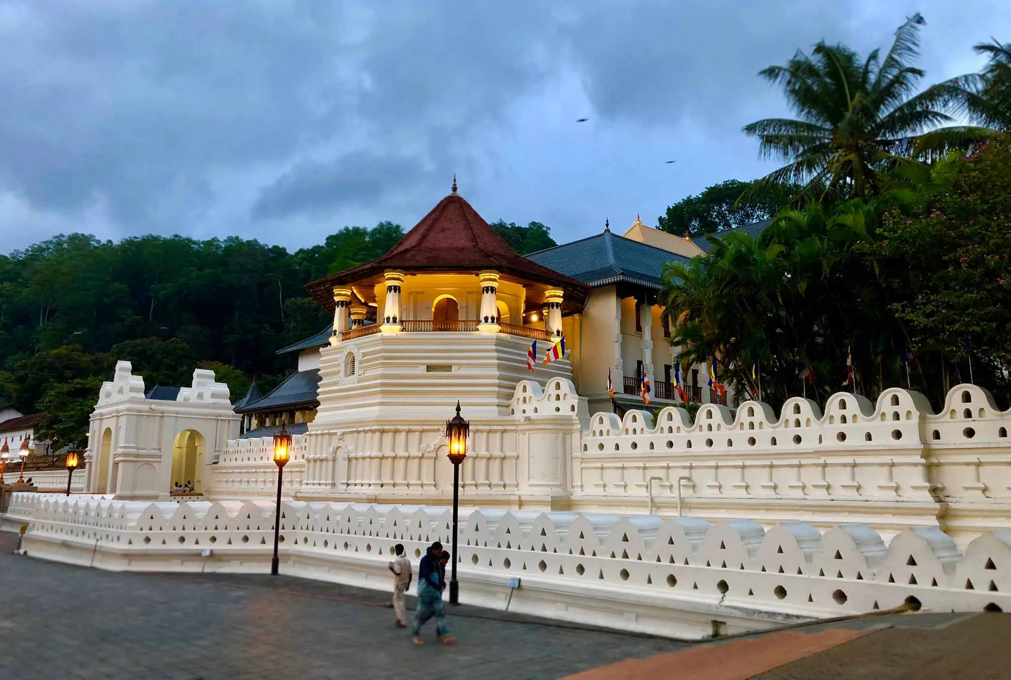 The historic octagonal pavilion and decorative cloud wall of the Temple of the Sacred Tooth Relic in Kandy