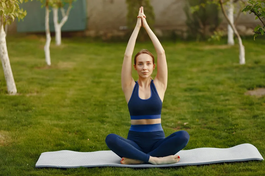 Restorative yoga practice in peaceful tropical garden
