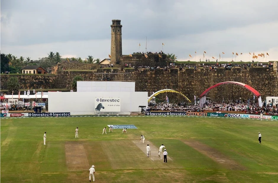 The Galle International Cricket Stadium with a view of Galle Fort and fort clock tower